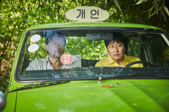 A scene from "A Taxi Driver" (2017) starring actor Song Kang-ho, right, and Thomas Kretschmann, left. [KOREA FILM ARCHIVE]