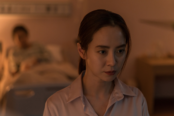 Mysterythriller "Intruder," featuring Song Ji-hyo, above, and Kim Moo-yul, will be released on June 4. The film was initially scheduled for premiere on May 21, but the film's distributors pushed back the date after a rise in coronavirus infections connected to central Seoul's Itaewon-dong neighborhood broke out last week. [ACEMAKER MOVIEWORKS] 