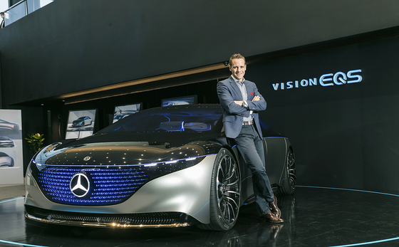 Mark Raine, product and marketing vice president at Mercedes-Benz Korea, poses next to the Vision EQS concept model at the company's showroom in Goyang, Gyeonggi. [MERCEDES-BENZ KOREA]