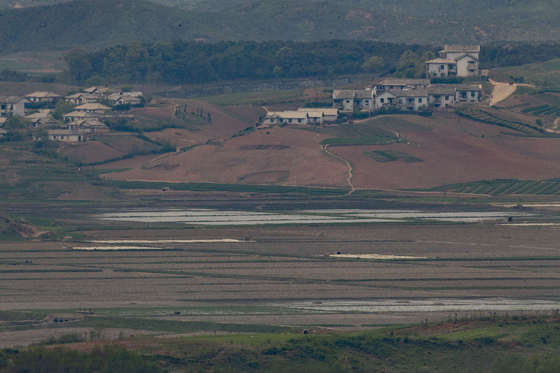 Rice paddies in North Korea's border county of Kaepoong, North Hwanghae Province, as seen from an observatory in Paju, Gyeonggi, in South Korea. [YONHAP]