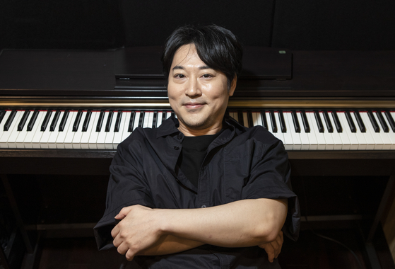 Pianist Yiruma poses for a photo during a recent interview with the JoongAng Ilbo. [KWON HYUK-JAE]