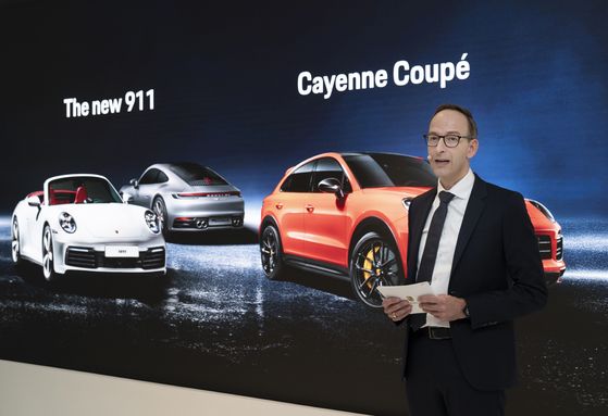 Porsche Korea CEO Holger Gerrmann speaks during the press conference at the brand's Cheongdam showroom on June 16. [PORSCHE KOREA]