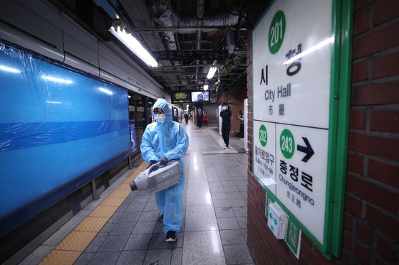 City Hall Station of lines No. 1 and 2 in Jung District, central Seoul, is disinfected Wednesday after Seoul Metro announced three Covid-19 cases among its workers there this week. [NEWS1]