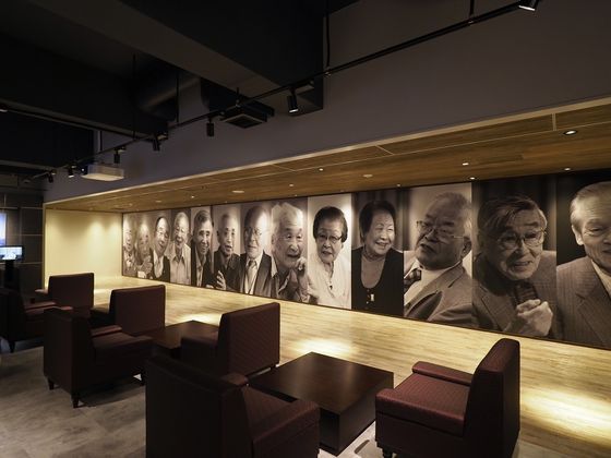 Photos of former residents of Hashima Island at the the Industrial Heritage Information Centre in Tokyo. Japan pledged in 2015 to commemorate laborers forced to work under brutal conditions at some of these industrial sites during World War II, but the center does not introduce such content in its exhibitions. [YONHAP]