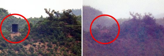 North Korea removed propaganda loudspeakers in the demilitarized zone on Wednesday, as shown on the right, just two days after setting them up on Monday afternoon. [YONHAP]