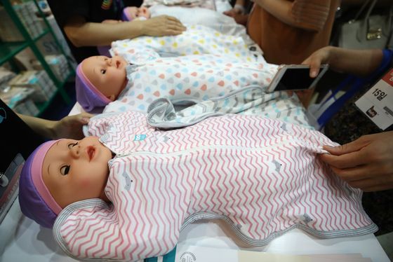 Baby clothes sold during the Baby Fair at Coex in southern Seoul in August 2019. [YONHAP]