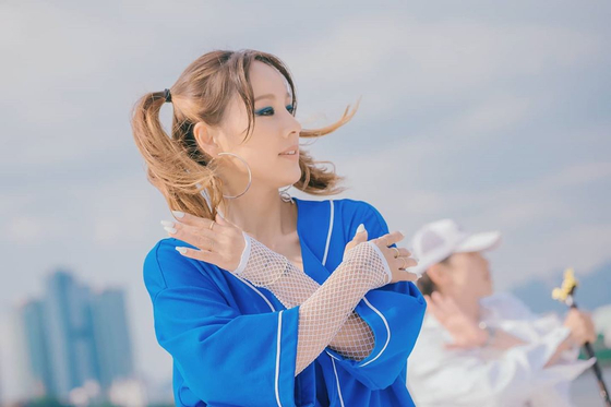 Lee Hyo-ri in the music video for "In Summer." [MBC]