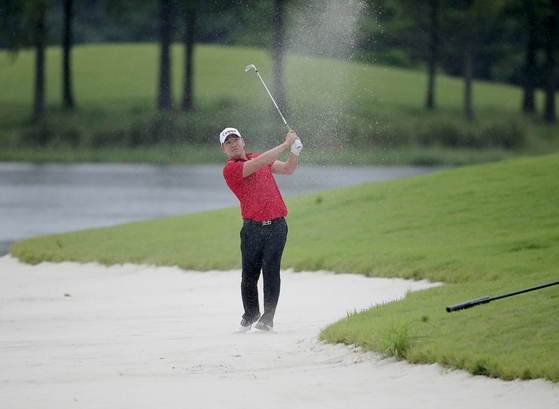 Kang Kyung-nam watches his shot during the first round of the 63rd KPGA Championship at A-One Country Club in Yangsan, South Gyeongsang, on Thursday. [KPGA]