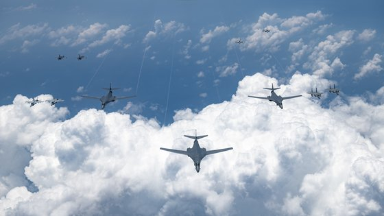 U.S. B-1B bombers fly alongside other U.S. and Japanese fighters in an aerial operation near the Korean Peninsula and Japan on Monday, in a photograph from the U.S. Indo Pacific Command website. [YONHAP]
