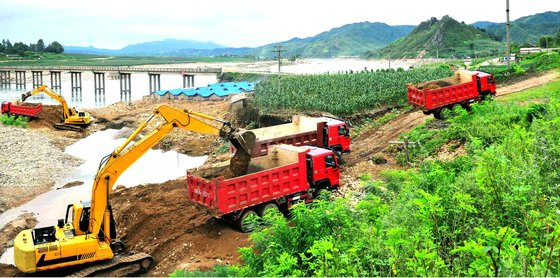Recovery work is underway at an area in North Korea's Kangwon Province damaged by flooding earlier this month. [NEWS1]