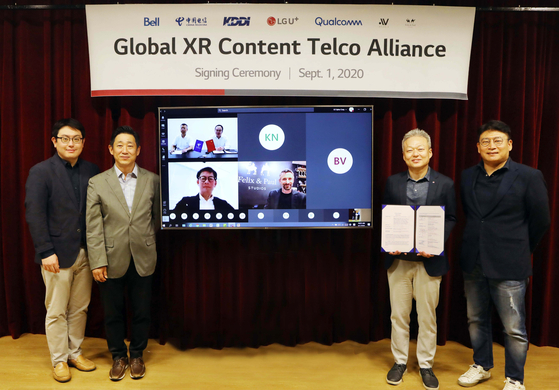 LG U+ executives pose with XR Content Telco Alliance partners after signing an agreement on Tuesday at the company's headquarters in Yongsan, central Seoul. [LG U+] 