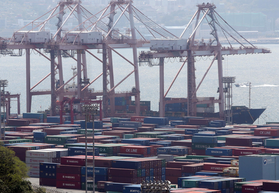 Cargo to be exported stacked up at a port in Busan in May. [YONHAP]
