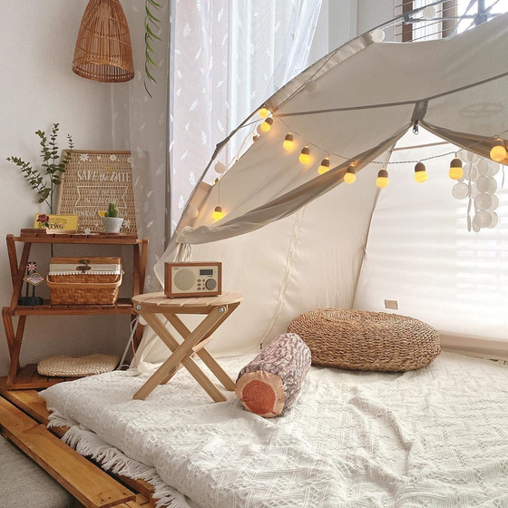 A room is decked with camping gear. [LEE HYEON-AH]