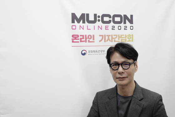 Singer and songwriter Yoon Sang, who is also this year's MU:CON art director, poses for photos prior to an online interview with the local press on Wednesday afternoon. [KOCCA]