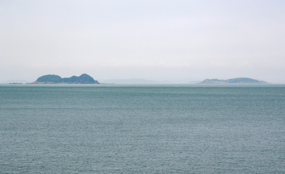 North Korean islands off the country's western coast, seen from South Korea's Large Yeonpyeong Island in June. [YONHAP]
