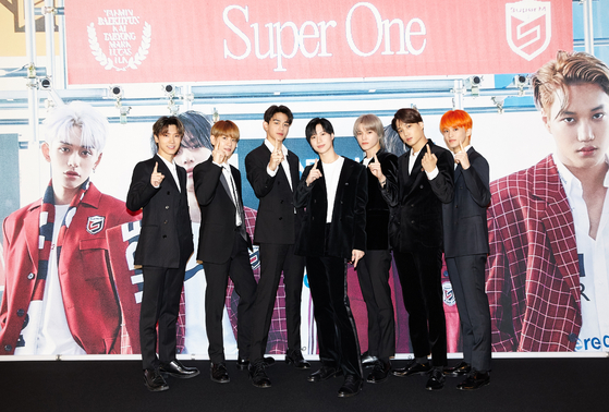 Boy band SuperM poses for photos prior to the online press conference held on Friday morning for the release of its first full-length album "Super One." [SM ENTERTAINMENT]