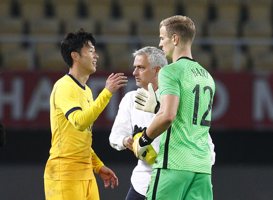 Son Heung-min of Tottenham Hotspur, left, celebrates with his Joe Hart and head coach Jose Mourinho after scoring the club's second goal of the match against Shkenjija during the third-round qualifying match at the UEFA Europa League at National Arena Todor Proeski in Skopje, North Macedonia on Thursday. [REUTERS/YONHAP] 