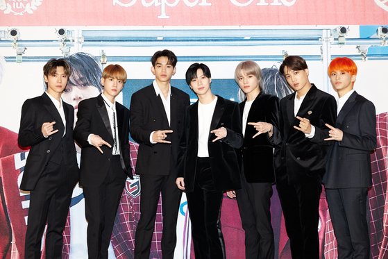 Boy band SuperM poses for photos prior to the online press conference held on Friday morning ahead of the release of its first full-length album "Super One." [SM ENTERTAINMENT]