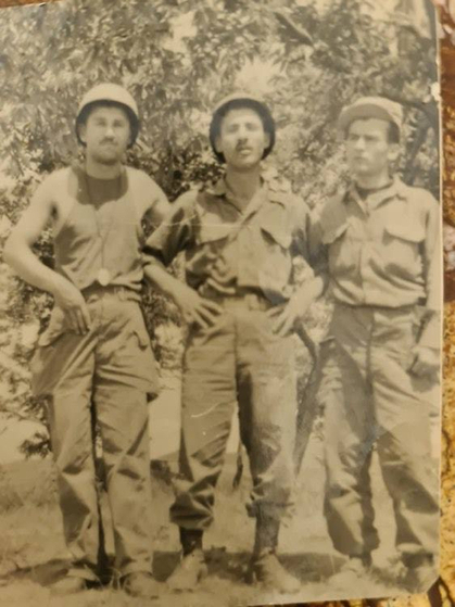 Mehmet Ziya Ozturk, center, in a photo taken during the Korean War. Ozturk was a communications officer for the Turkish brigade and arrived in October 1952 at the age of 21. [MEHMET ZIYA OZTURK]