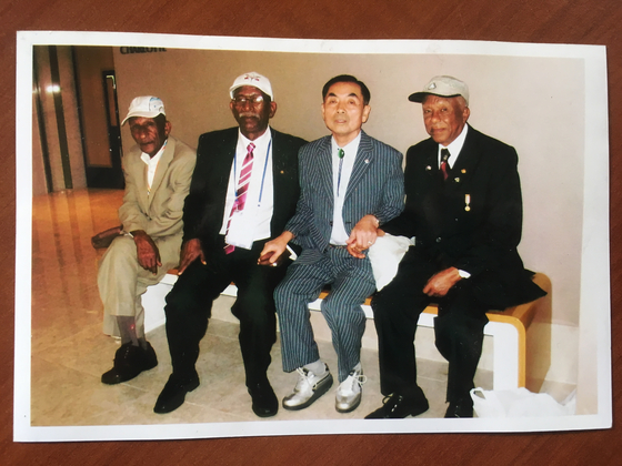 Debela, far right, with Sintayehu, second from right, during their meeting in Korea in 2010. [MELESSE TESSEMA DEBELA]