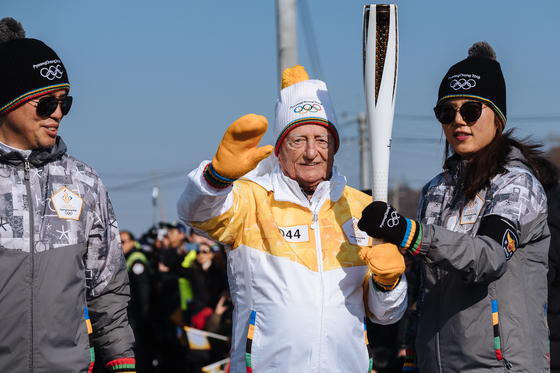 Charland when he revisited in 2018 carrying a torch in a relay for the PyeongChang Olympics in Gangwon. [CLAUDE CHARLAND]