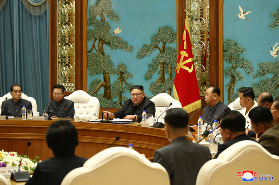 North Korean leader Kim Jong-un, center, presides over a political bureau meeting of the Workers' Party Central Committee on Monday. [YONHAP]