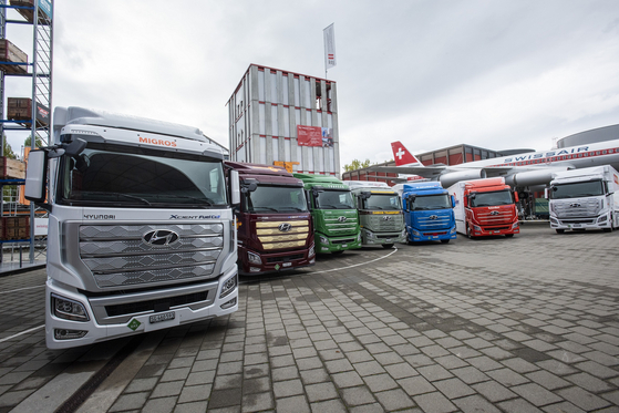 Seven units of Hyundai Motor's Xcient Fuel Cell that were exported to Switzerland are parked in front of the Swiss Museum of Transport in Luzern on Oct. 7. [HYUNDAI MOTOR]