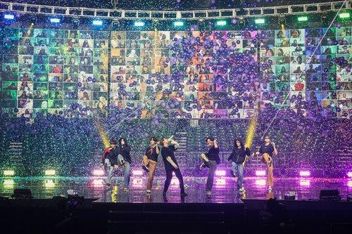 Fans’ faces appear behind BTS during the BTS Map of the Soul ON:E concert on Saturday. [BIG HIT ENTERTAINMENT]