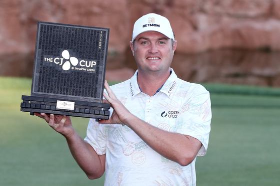 Jason Kokrak of the United States poses for a photo with the trophy after wining the CJ CUP @ SHADOW CREEK in Las Vegas, Nevada on Sunday. [GETTY IMAGES FOR THE CJ CUP]