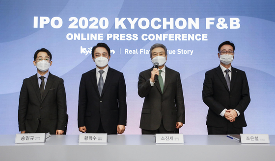 Executives from Kyochon F&B attend a press conference ahead of its initial public offering in October. [KYOCHON F&B]