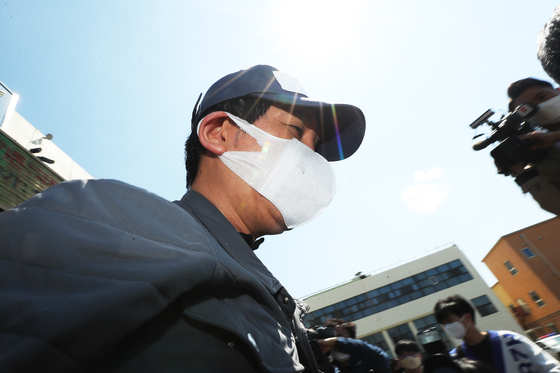 Kim Bong-hyun, former chairman of Star Mobility and key suspect in a financial fraud scandal surrounding Lime Asset Management, in a file photo taken after his arrest in April. [YONHAP]
