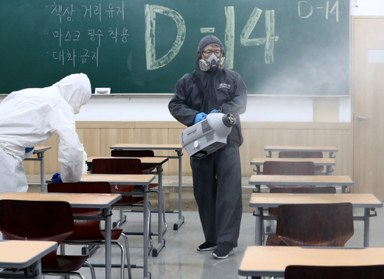 A worker disinfects a hagwon (cram school) in Daejeon Thursday, two weeks before the annual College Scholastic Ability Test (CSAT). [NEWS1]