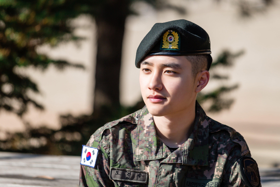 Singer D.O. of boy band Exo takes part in the Military Manpower Administration's ″Pride in Military″ campaign to heighten awareness about mandatory military duties [MMA]