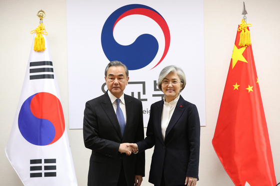 Chinese State Councilor and Foreign Minister Wang Yi, left, poses with Korean Foreign Minister Kang Kyung-wha on Dec. 4, 2019, at the Foreign Ministry in central Seoul. Wang kicks off a three-day visit to Korea Wednesday. [YONHAP]