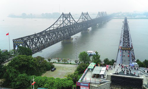 A view of the Yalu River Bridge, which connects Sinuiju, North Korea and Dandong, China. China is the North's biggest trade partner. [AP PHOTO/EMILY WANG]
