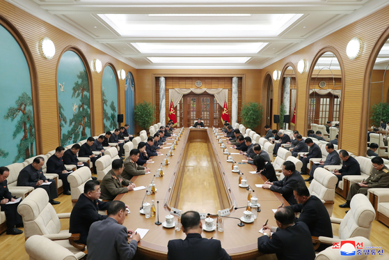 North Korea holds an enlarged meeting of its ruling Workers' Party Political Bureau in Pyongyang on Sunday, with full and alternate members in attendance, in a photograph released by the Korean Central News Agency. During the meeting, economic officials were "harshly criticized," according to the state-run news service. [YONHAP]