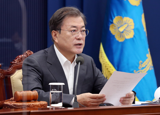 In this file photo, President Moon Jae-in hosts the weekly cabinet meeting through a videoconference from the Blue House on Tuesday.  [YONHAP] 