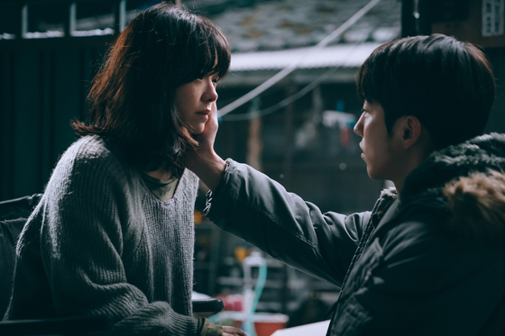 Scenes from the film ″Josee,″ set to premiere in local theaters on Thursday. Actor Han Ji-min portrays Josee and Nam Joo-hyuk as Young-seok, her romantic interest. [WARNER BROS KOREA]