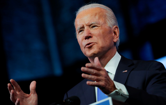 U.S. President-elect Joe Biden delivers a televised address to the nation after the U.S. Electoral College formally confirmed his victory over President Donald Trump in the 2020 U.S. presidential election, from Biden's transition headquarters at the Queen Theater in Wilmington, Delaware, on Monday.  [REUTERS] 