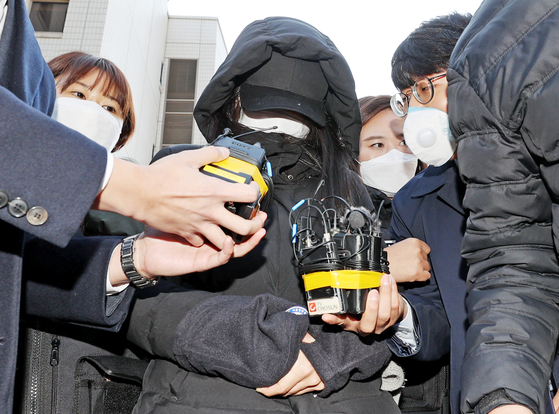 Jeong-in's adopted mother leaves the Seoul Southern District Court after a detention warrant hearing on Nov. 11, 2020. [YONHAP]