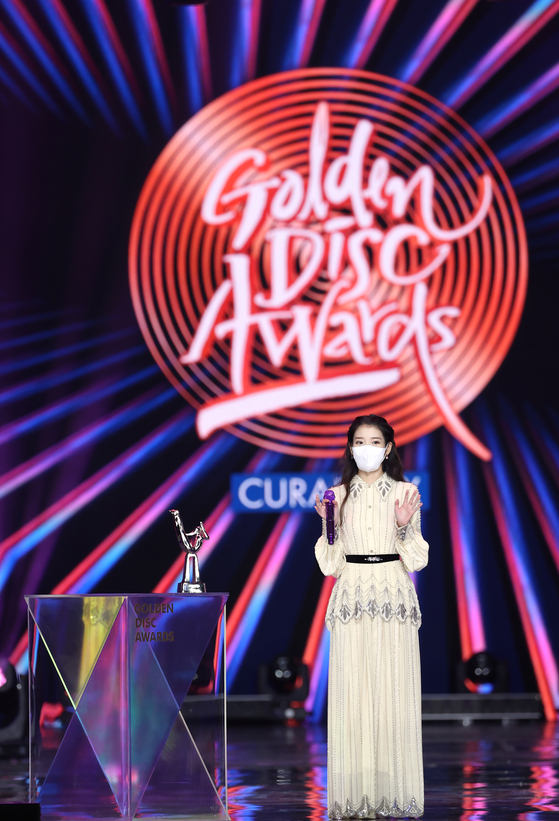 Singer-songwriter IU prepares to sing an encore after winning the Grand Prize in the Digital Song category of the 35th Golden Disc Awards. The awards ceremony was held at Kintex in Goyang, Gyeonggi, Saturday evening.