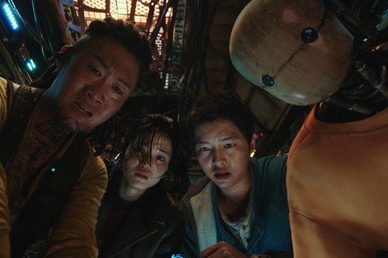 From left, actors Jin Sun-kyu, Kim Tae-ri, Song Joong-ki and Yoo Hae-jin as crew members of the spaceship The Victory in Netflix film 'Space Sweepers." [NETFLIX] 