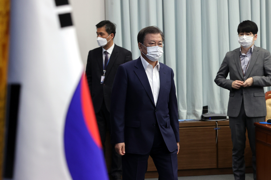 President Moon Jae-in attends a cabinet meeting at the Blue House where a 19.5 trillion won stimulus package was approved on Tuesday. [YONHAP]