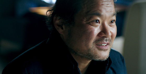 Sung-ha (played by Kim Sang-ho) is a photographer who believes that a miracle could save his wife from death. [ATNINE FILM]