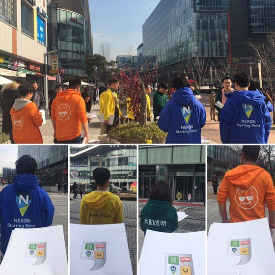 Colored hoodies represent labor unions of four IT and game companies in Pangyo Techno Valley, Gyeonggi. Blue represents Nexon's labor union, yellow for Kakao, green for Naver and orange for Smilegate. [NAVER UNION] 