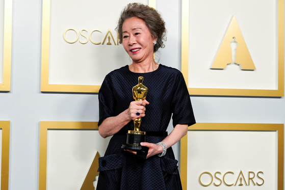 Youn Yuh-jung, winner of the award for Best Actress in a Supporting Role for ″Minari,″ poses in the press room at the Oscars in Los Angeles. [REUTERS/YONHAP]
