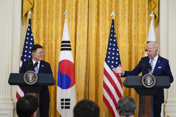 President Joe Biden, right, speaks during a joint news conference with Korean President Moon Jae-in, in the East Room of the White House on Friday in Washington.  [AP] 