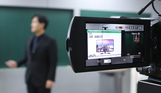 A teacher recording a class to be streamed online in Ulsan in March 2020. [YONHAP]