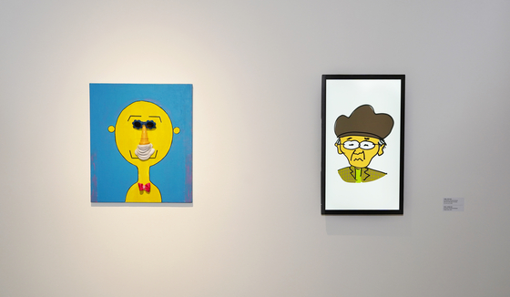 The portrait of Joo Ho-min created by his father Joo Jae-hwan, left, and a portrait of the father illustrated by his son open up the ″Homin and Jaehwan″ exhibition now held at the Seoul Museum of Art. [JEON TAE-GYU]