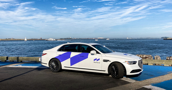 A Genesis G90 wrapped with Motional's logo [HYUNDIA MOTOR]